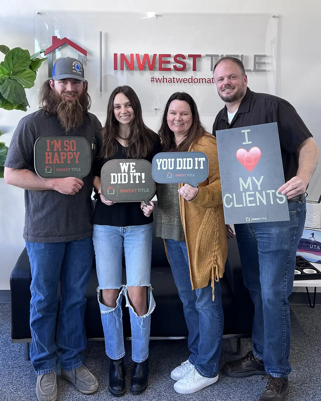 Scott Buehler celebrating with a happy family after a successful home closing